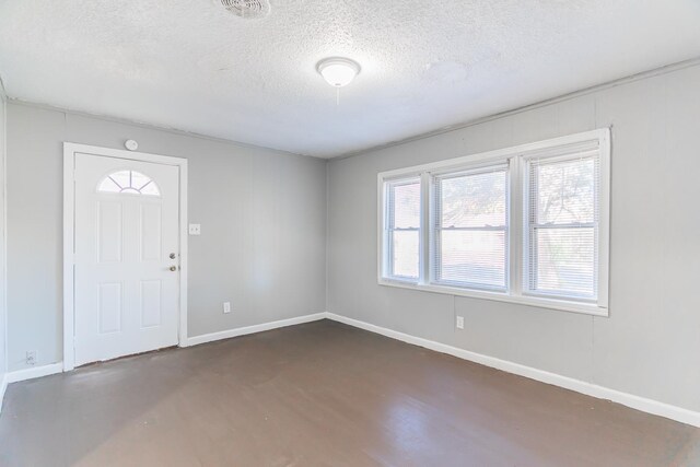 entrance foyer with a textured ceiling