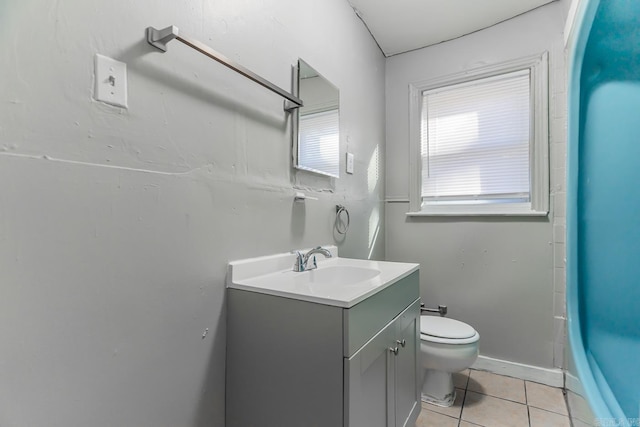 bathroom with vanity, a shower, tile patterned floors, and toilet