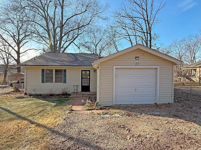 single story home featuring a garage and a front yard