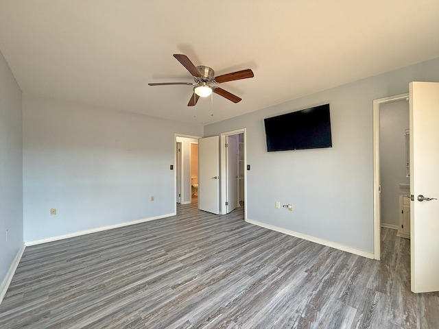 unfurnished bedroom featuring hardwood / wood-style flooring and ceiling fan