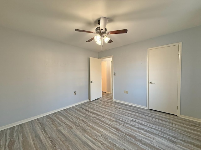 unfurnished bedroom featuring ceiling fan and light hardwood / wood-style flooring