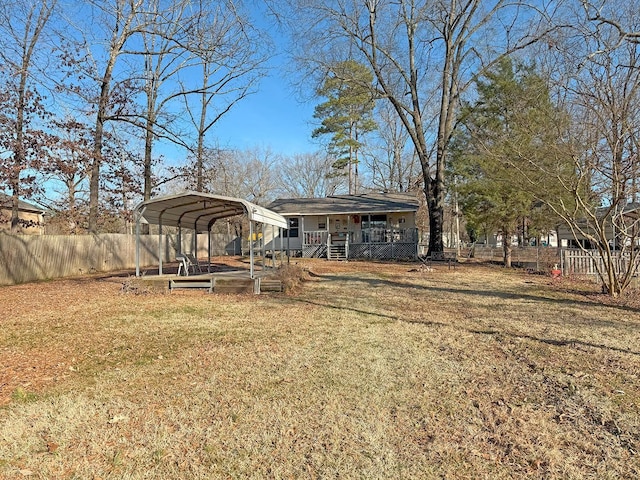 view of yard with a carport