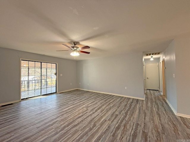 spare room featuring hardwood / wood-style flooring and ceiling fan