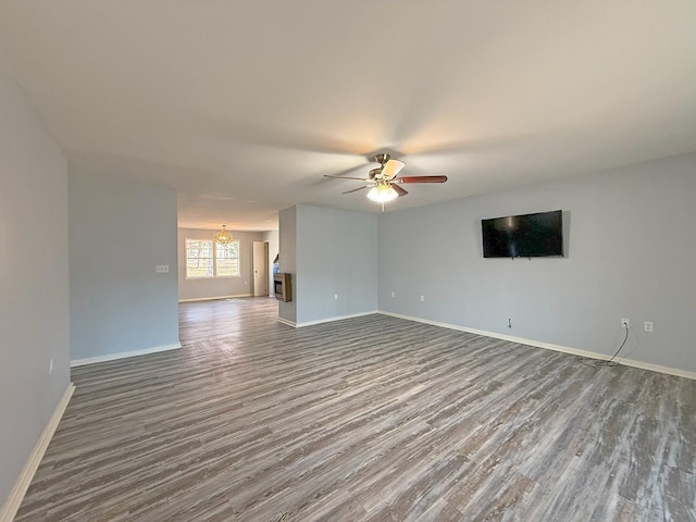 empty room with wood-type flooring and ceiling fan