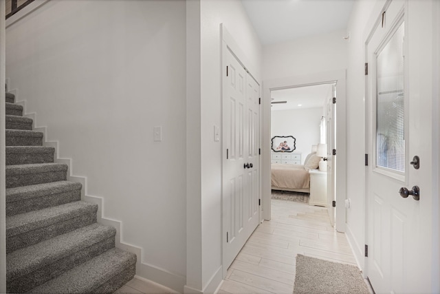 hall with light wood-type flooring