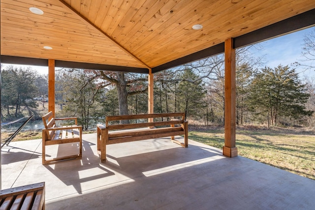 sunroom with lofted ceiling and wood ceiling