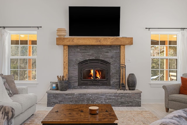 living room featuring a healthy amount of sunlight and light hardwood / wood-style flooring