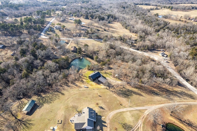 birds eye view of property with a rural view and a water view