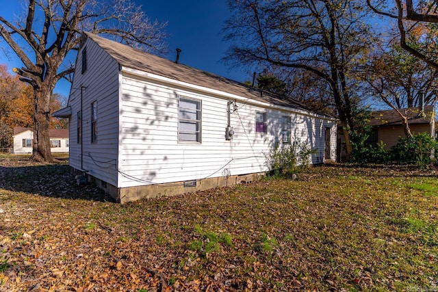 view of property exterior featuring a lawn