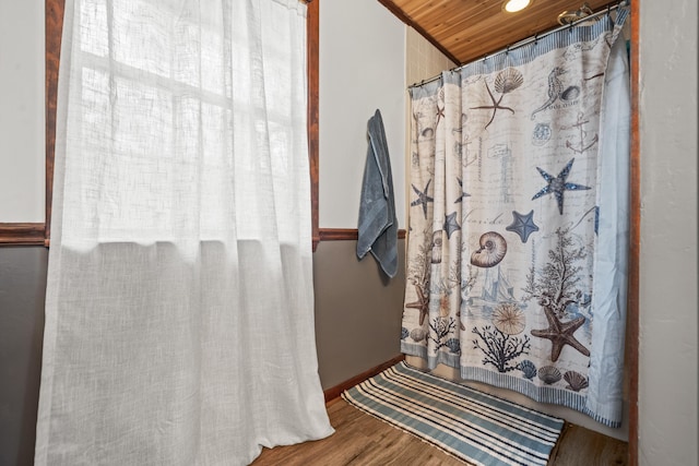 bathroom featuring hardwood / wood-style floors and wooden ceiling