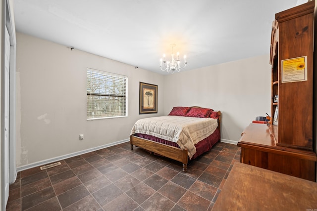 bedroom with a notable chandelier