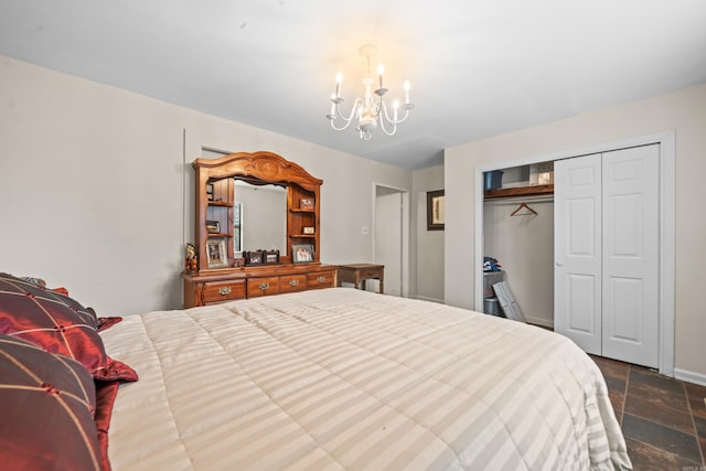 bedroom with an inviting chandelier and a closet