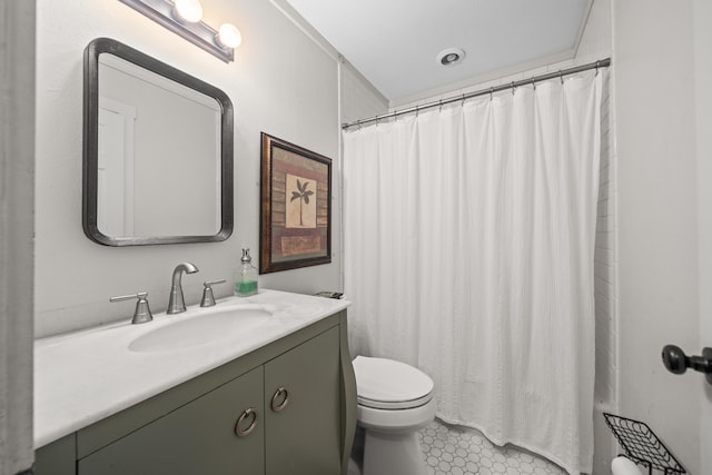 bathroom with vanity, toilet, and a shower with shower curtain