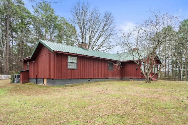 view of property exterior featuring a lawn