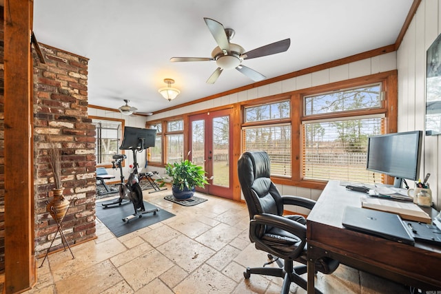 home office with french doors, ceiling fan, crown molding, and wooden walls