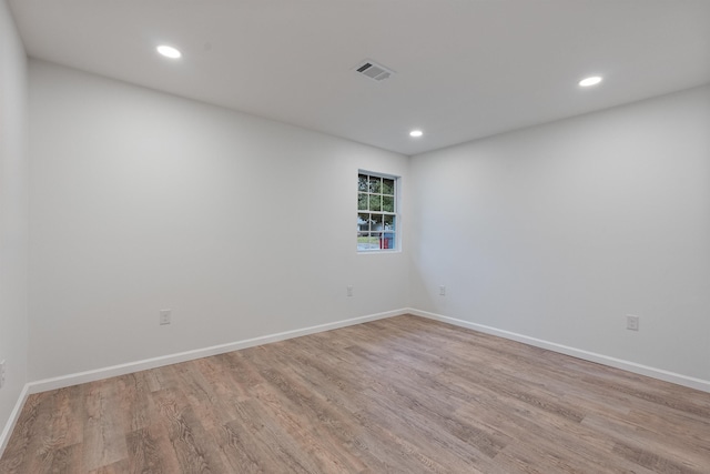 spare room with light hardwood / wood-style flooring