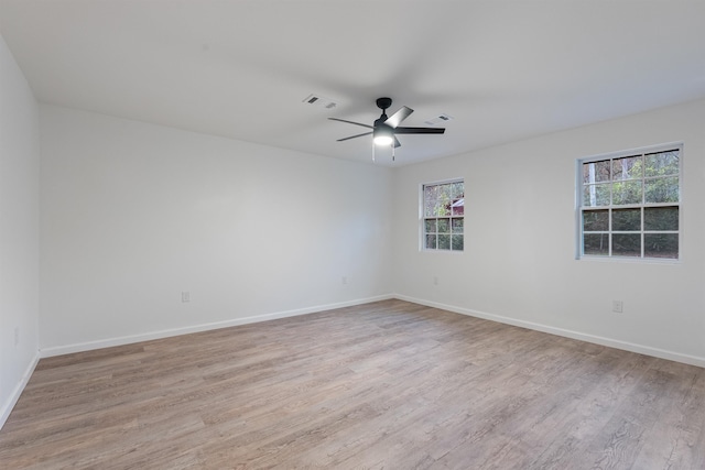 spare room featuring ceiling fan and light wood-type flooring