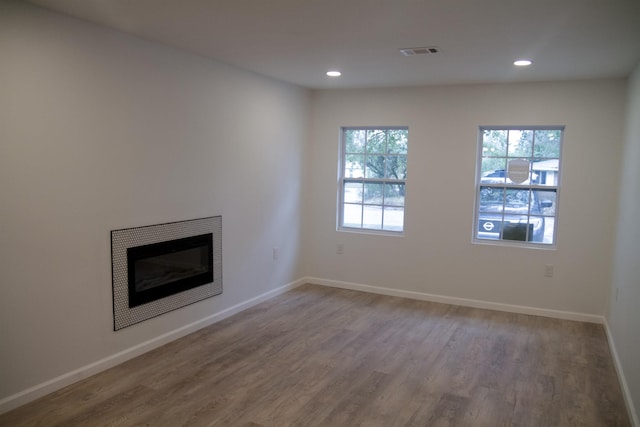 unfurnished living room with hardwood / wood-style floors