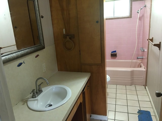 full bathroom with shower / tub combination, tile patterned floors, toilet, and vanity