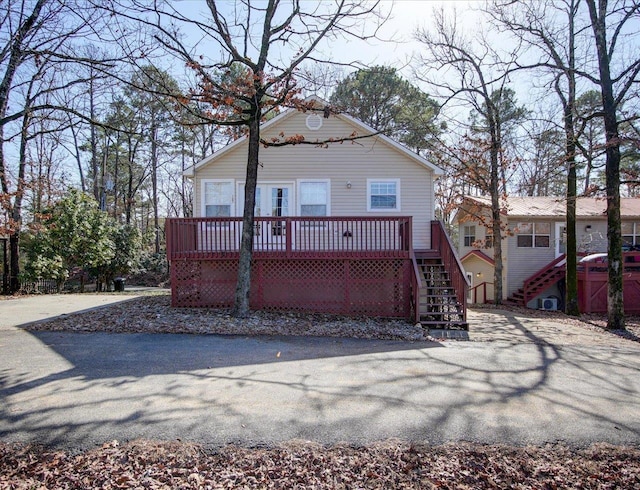 back of property featuring a deck