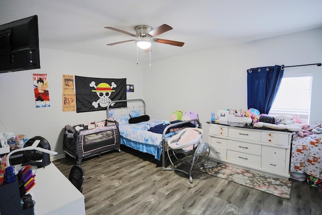 bedroom with hardwood / wood-style floors and ceiling fan