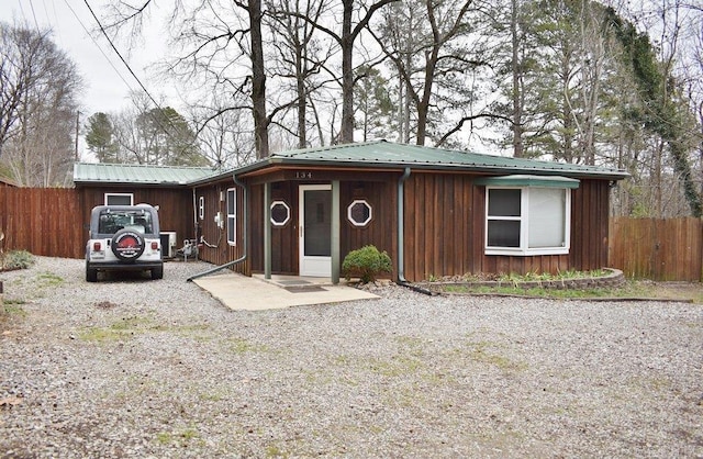 view of front of home with a patio area and central air condition unit