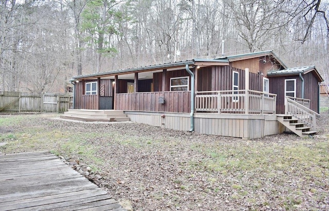 view of front of property featuring a wooden deck