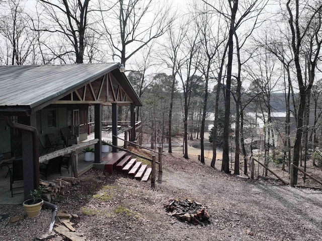 view of yard with a fire pit