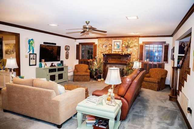 carpeted living room with ceiling fan, ornamental molding, and a fireplace