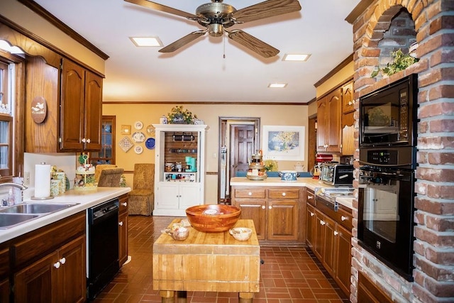 kitchen featuring crown molding, sink, ceiling fan, and black appliances