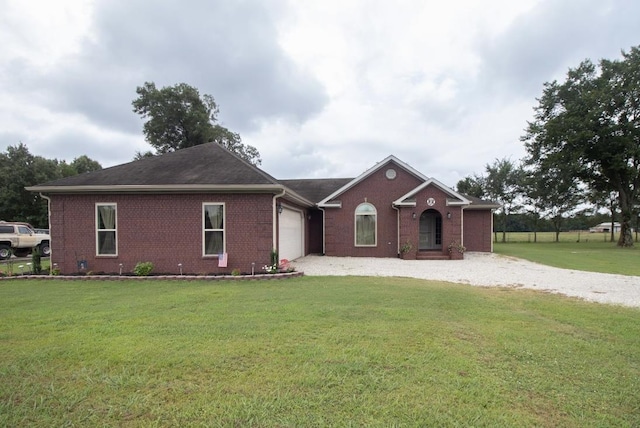 single story home featuring a garage and a front lawn