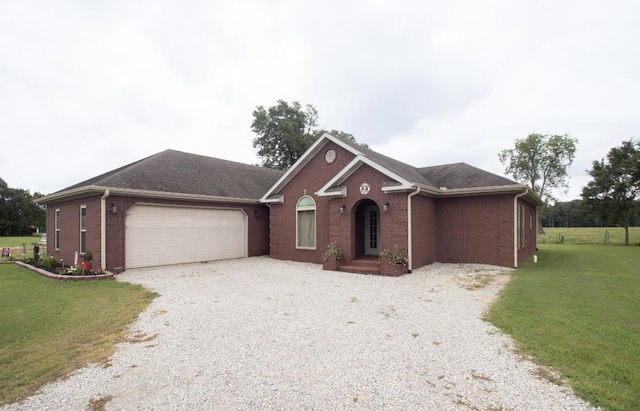 ranch-style house with a garage and a front yard