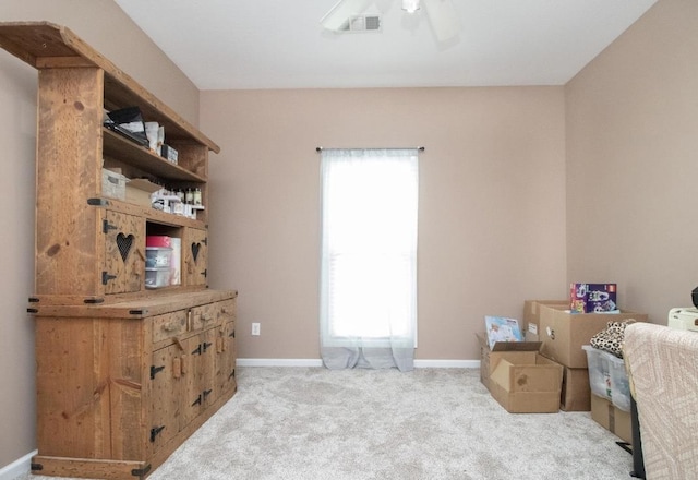 carpeted bedroom featuring multiple windows