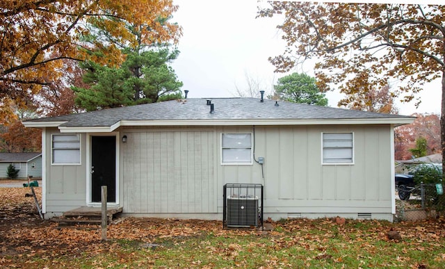 rear view of house with central air condition unit