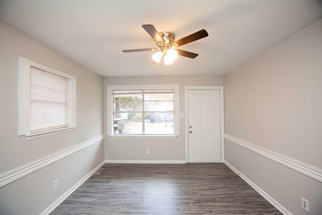 unfurnished room featuring ceiling fan and dark hardwood / wood-style floors