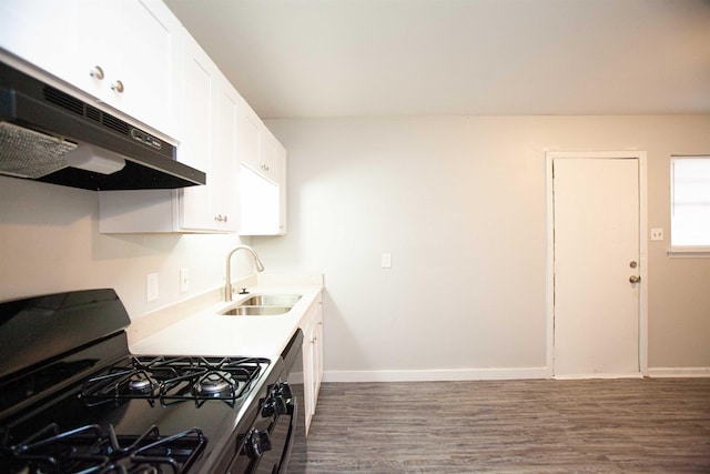 kitchen featuring dark wood-type flooring, sink, dishwasher, black gas range, and white cabinets