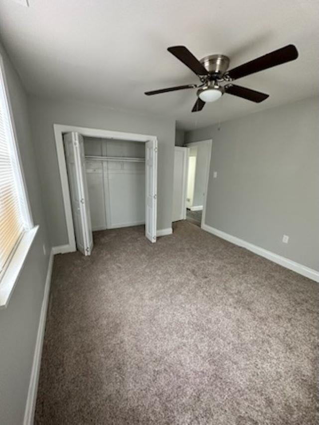 unfurnished bedroom with a closet, ceiling fan, and carpet