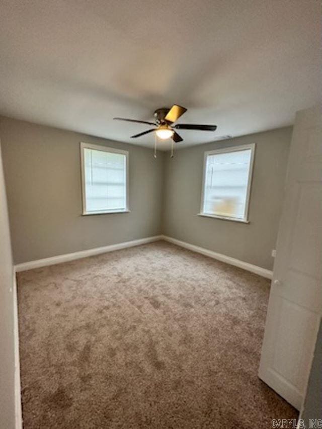 carpeted empty room with ceiling fan