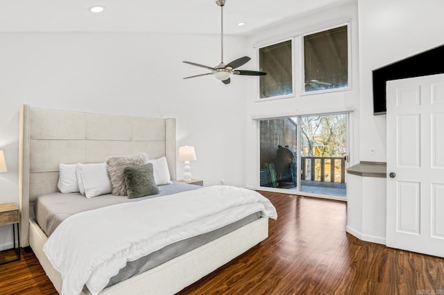 bedroom featuring access to exterior, vaulted ceiling, dark hardwood / wood-style floors, and ceiling fan