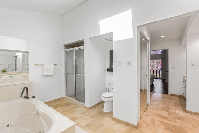 full bathroom featuring vanity, shower with separate bathtub, and toilet