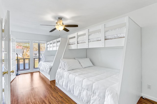 bedroom featuring ceiling fan, dark hardwood / wood-style floors, and access to outside