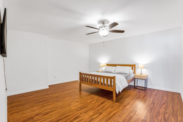 bedroom featuring dark hardwood / wood-style flooring and ceiling fan