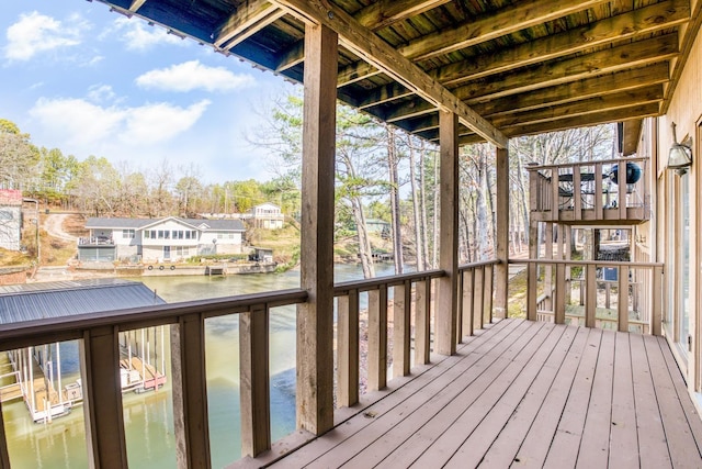 wooden deck featuring a water view