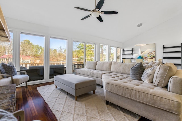 living room with lofted ceiling, hardwood / wood-style floors, and ceiling fan