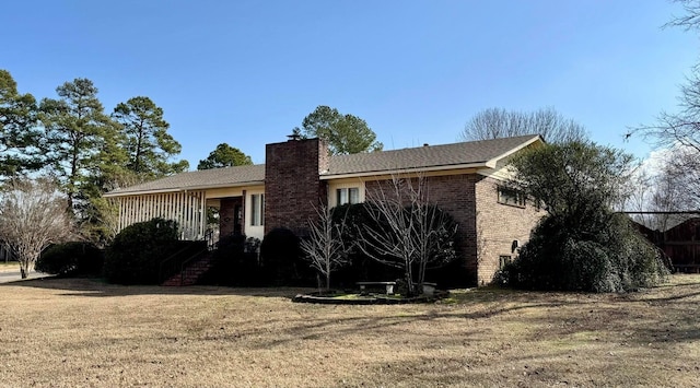 ranch-style house with a front lawn