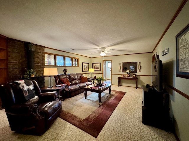 living room featuring a wood stove, carpet, ceiling fan, crown molding, and a textured ceiling