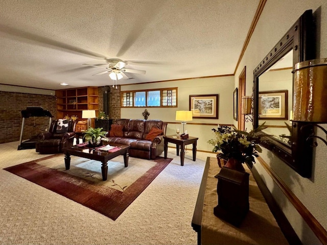 carpeted living room featuring crown molding, ceiling fan, a textured ceiling, and a wood stove