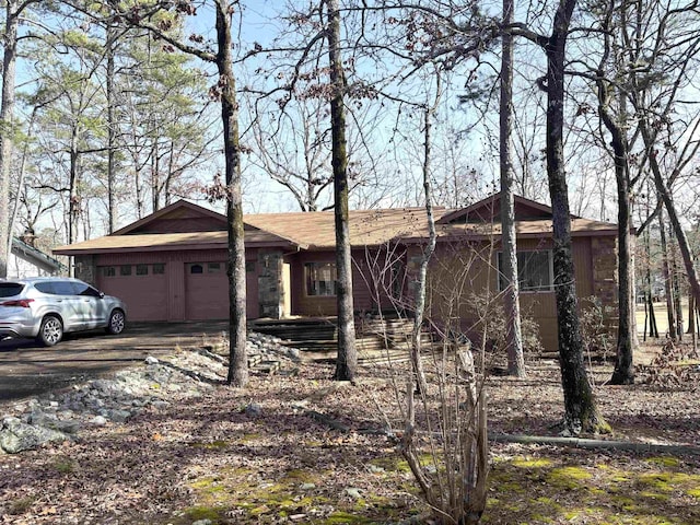 ranch-style house featuring a garage