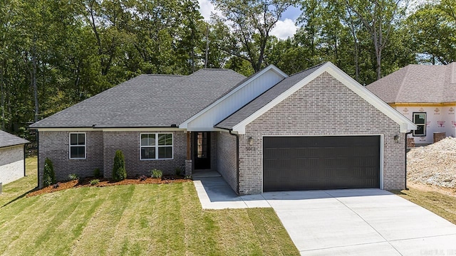 view of front facade with a garage and a front lawn