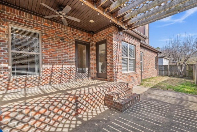 view of patio with ceiling fan and a deck